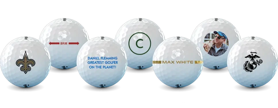 Five golfballs. one with two arrows pointing in the center pointing away from the letters BRM, one with the text dani flemming greatest golfer on the planet! printing on it, one with a monogram TG, one with two lines on the ball with the name Chris brewer between them, and one with a photo of a man and a dog.
